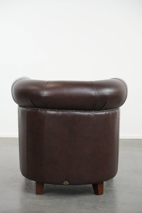 Image 1 of Cowhide club armchair, in very good condition, English style in a brown/dark purple color scheme