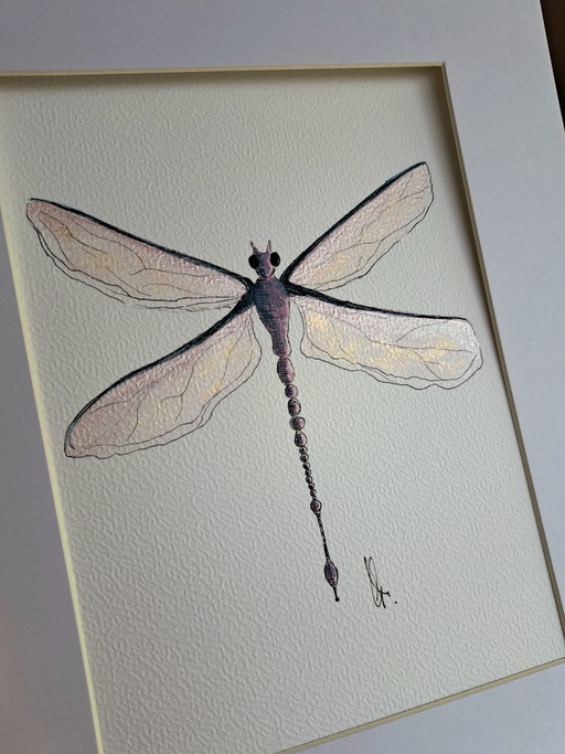 Watercolor painting of a dragonfly in a gold-colored frame