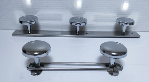 two vintage chrome-plated metal coat hooks