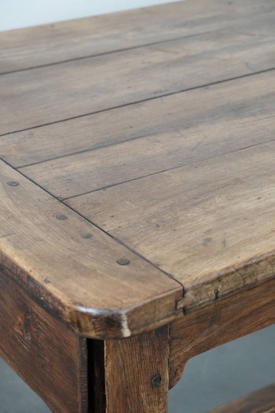 Image 1 of Robust antique French 6-person dining table made of fruit wood with 3 drawers from the late 18th century