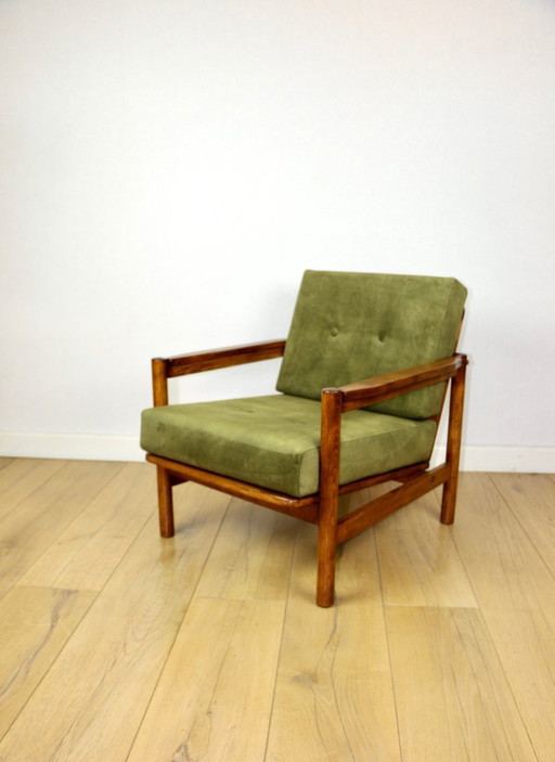 Wooden armchair designed by Z. Baczyk in a vintage style, upholstered in olive green velvet.