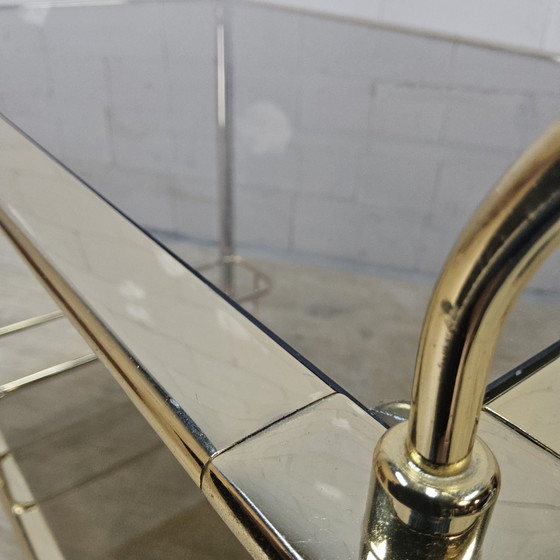 Vintage golden brass bar cart / trolley smoked glass shelves (photo 12 of 15)