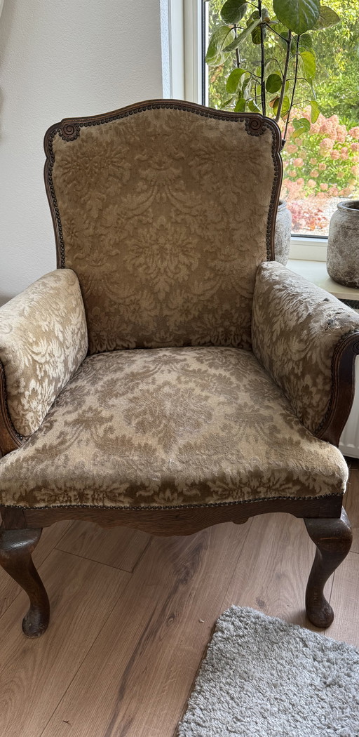 Vintage chair with floral motif, old-fashioned armchair