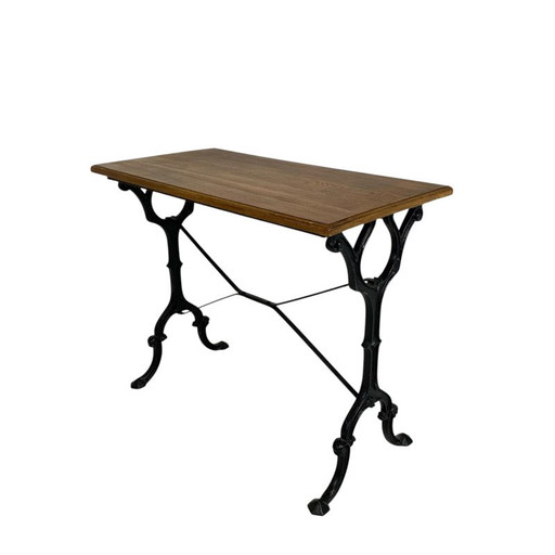 Bistro table with oak top on cast iron frame, 1930s