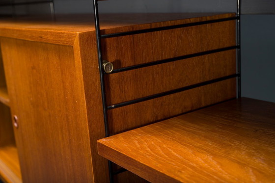 Image 1 of Modulaire wandplank in teak van Nils Strinning voor String, 1960, set van 29