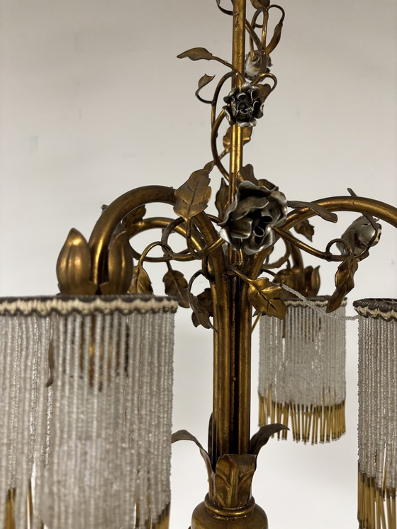 Image 1 of Exclusive chandelier with brass leaves and silver-colored roses