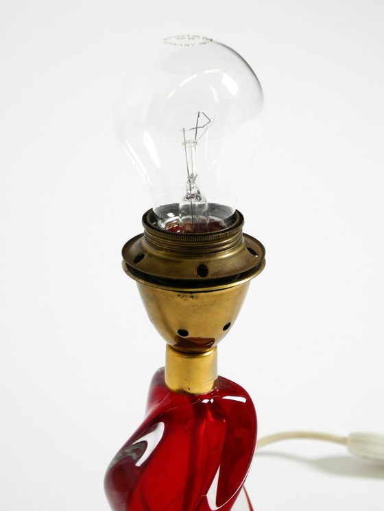 Image 1 of Beautiful heavy mid-century modern table lamp made of solid crystal glass in red and transparent