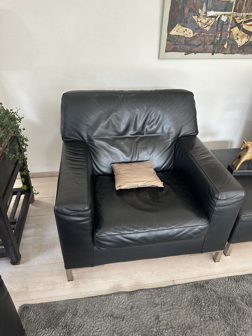 Two leather armchairs and ottoman by Verzelloni