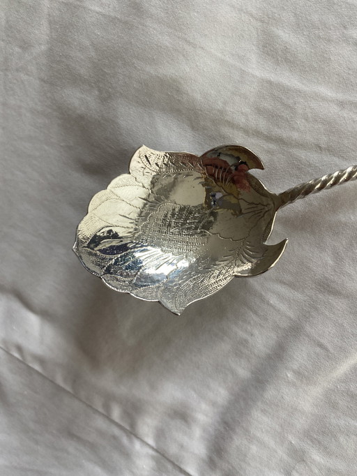 Silver djokja sugar spoon with wajang doll, Indonesia, 800