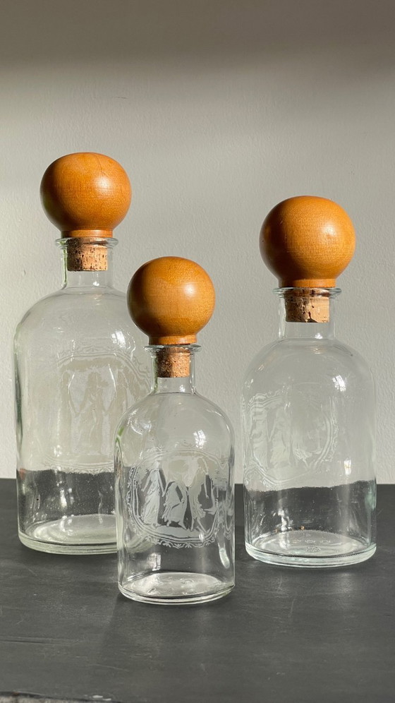 Image 1 of Vintage Engraved Glass and Wood Bottles