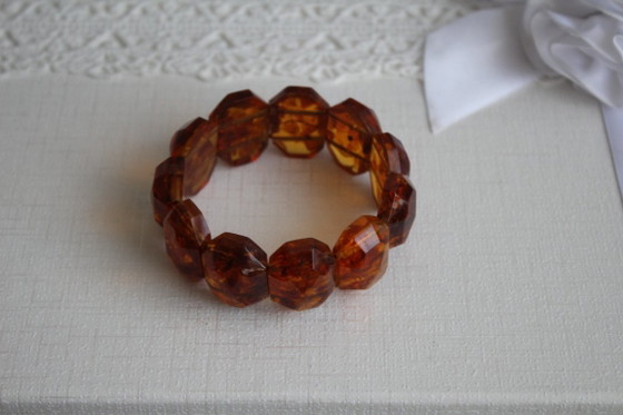 Image 1 of Amber bracelet, intricately cut, 46 grams of honey amber.