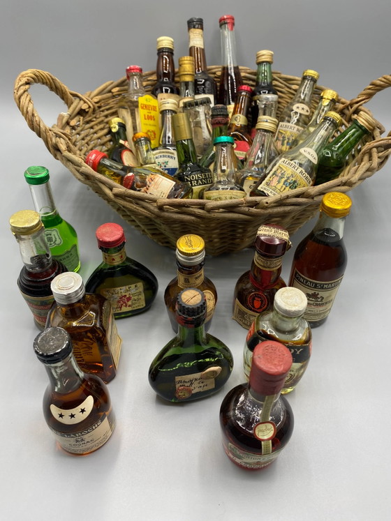 32 vintage miniature spirit bottles and large wicker basket – Decorative Objects, Glass, Mid Century Modern (photo 6 of 8)