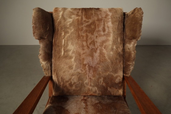 Brutalist oak lounge armchair and ottoman in original goat hide, 1960s – Wood (photo 11 of 15)
