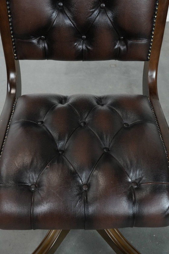 Image 1 of English-style Chesterfield office chair made of cowhide and wood on wheels