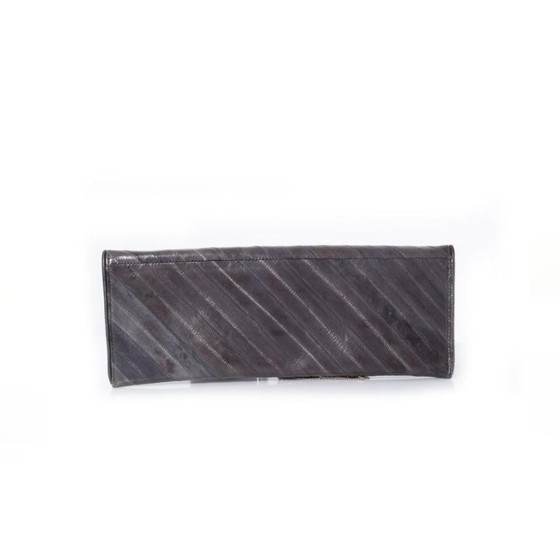 Image 1 of Maison Du Posh, pochette con anello a nocca e drago.