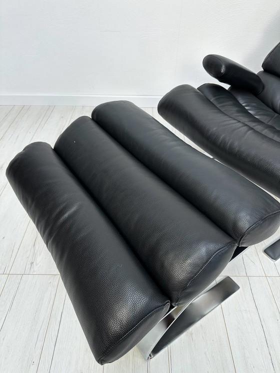 Image 1 of COR Sinus loungestoel en poef in zwart leer van Reinhold Adolf & Hans-Jürgen Schröpfer – Designicoon uit de jaren 70