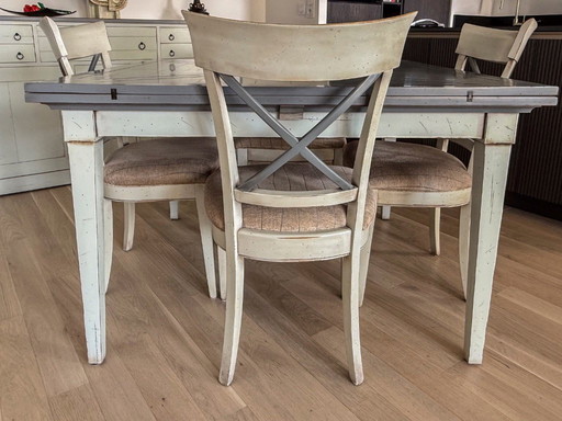Handkerchief table with 4 leaves and 4 chairs