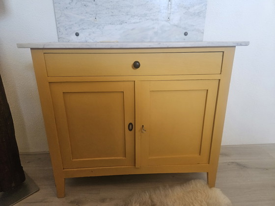 Image 1 of Vintage ochre yellow sideboard with marble top and mirror