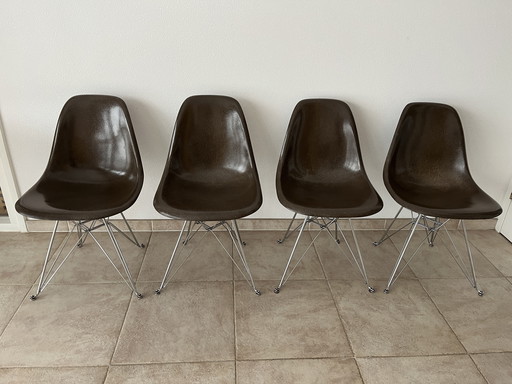 4 Eames sideshells and elliptical table by Hein and Matthson