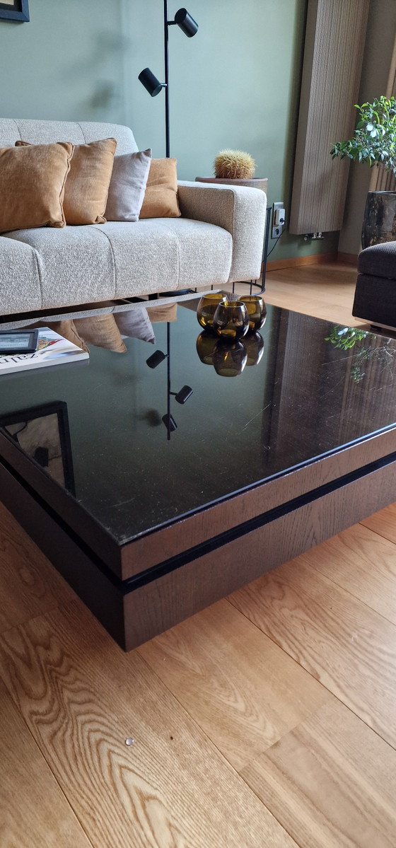 Image 1 of Veneer coffee table with dark glass top