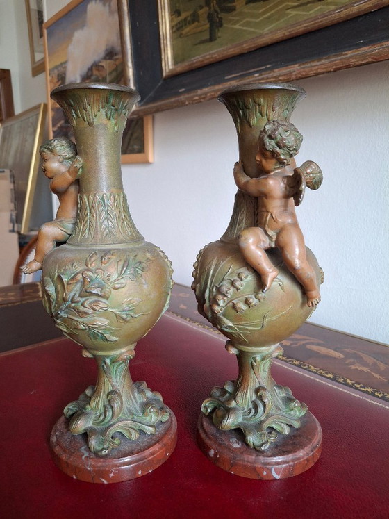 Image 1 of Pair of Art Nouveau spelter vases, circa 1900, with cherubs and a double patina