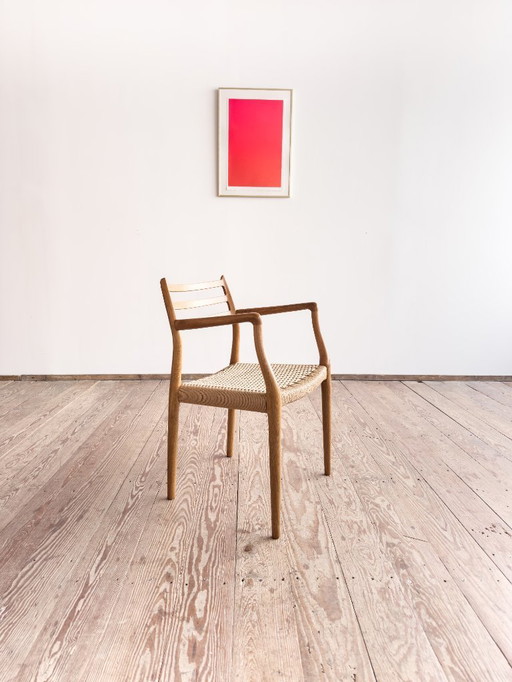 Esszimmerstuhl mit Armlehnen aus Eichenholz, Modell 62 für J.L. Moller