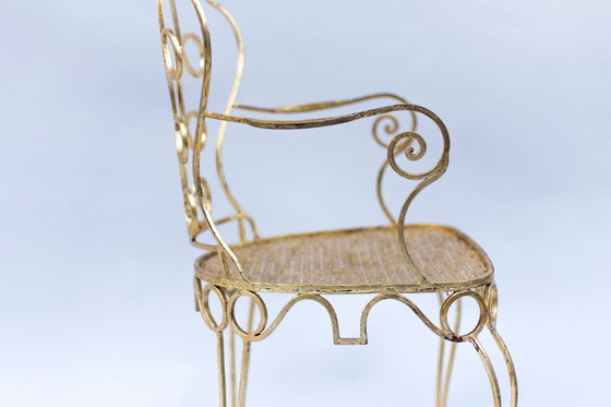 Image 1 of Par de sillones de hierro forjado y dorado, circa 1990.