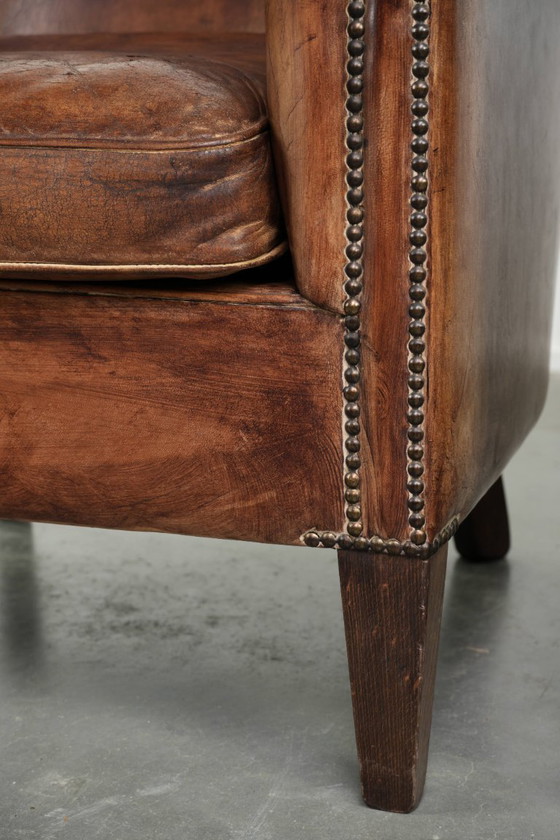 Image 1 of 2 fauteuils club vintage en peau de mouton, au look superbe et à l'assise confortable.