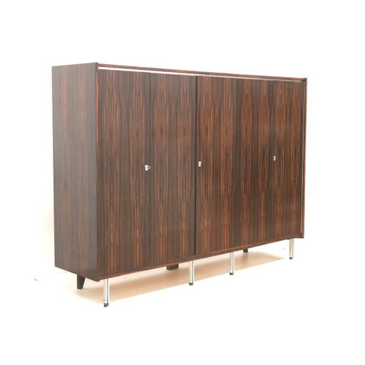 Large vintage designer closet with hanging and laying section from the 1960s