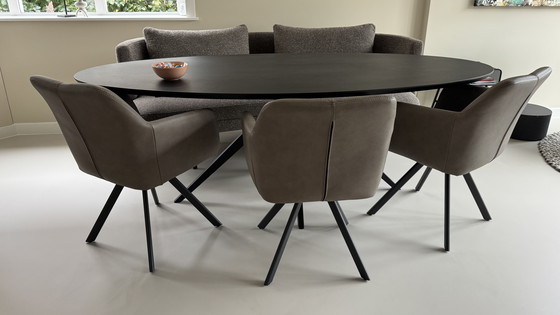 Image 1 of 3 draaibare eettafelstoelen met leer bekleed