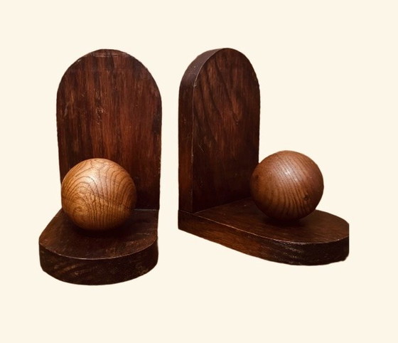 Image 1 of 2x Art Deco bookends. Left the paper in place and don't know if there is anything underneath.