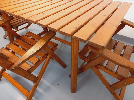 Image 1 of Vintage garden furniture consisting of a table with extensions and 4 wooden armchairs from the 60s