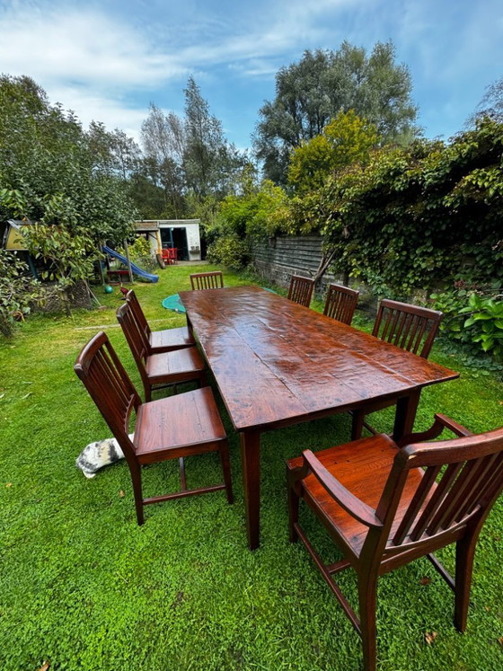 Image 1 of Grande table de salle à manger coloniale en teck massif avec 8 chaises et coussins