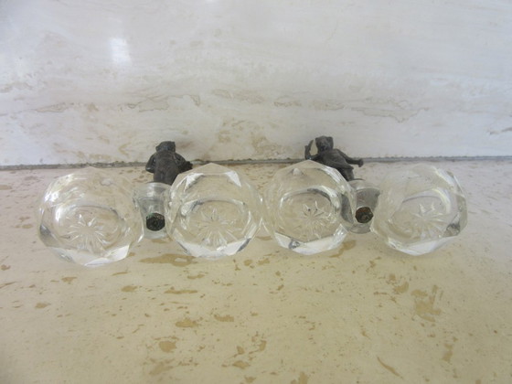 Image 1 of 2 recipientes para salero y pimentero con forma de ángeles querubines de cristal y metal negro (a uno de ellos le falta un ala) 