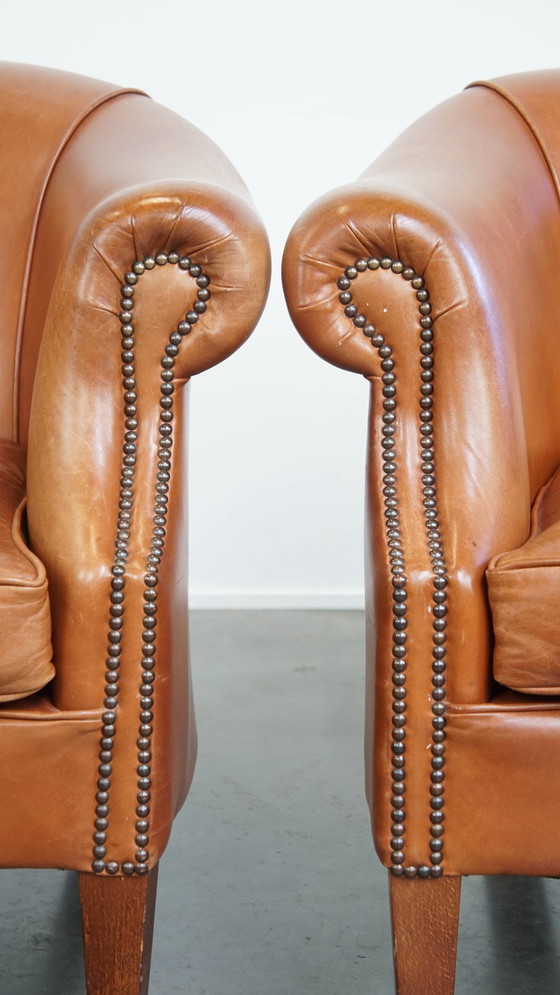 Image 1 of 2 x Cognacfarbener Rindsleder-Clubsessel mit dekorativem Nagelfinish