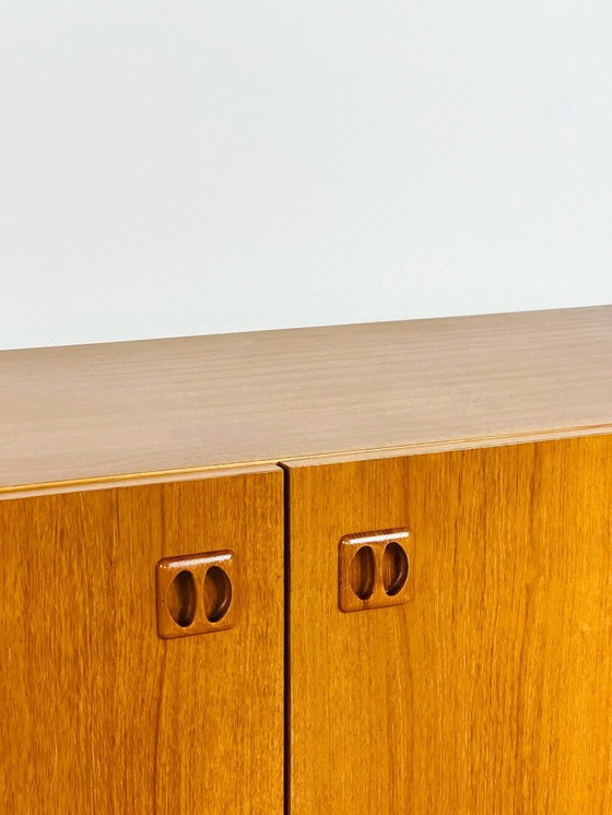 Image 1 of Minimalist Scandinavian sideboard in teak with black metal legs, 1960