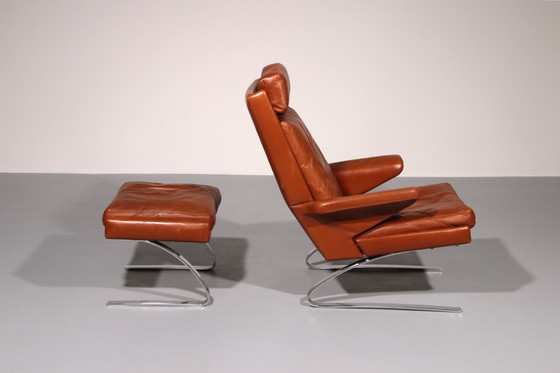 Image 1 of Cognac Leder COR Swing Lounge Stuhl mit Ottomane von Adolf & Schöpfer 1976
