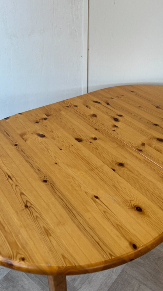 Image 1 of Oval pine extendable table.