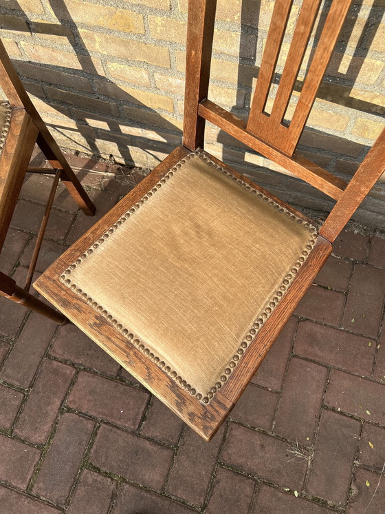 Image 1 of Dining room chairs with fabric seats and nail trim.