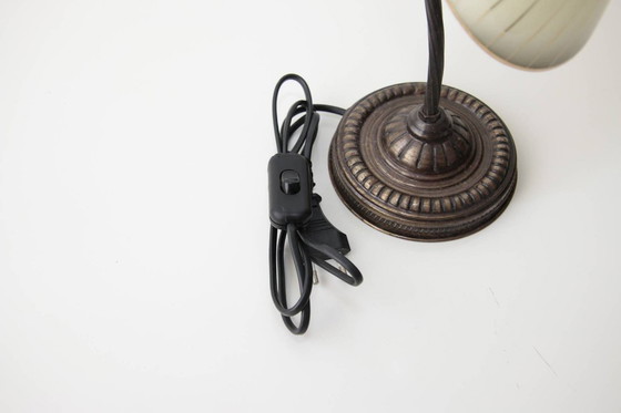 Image 1 of Vintage brass table lamp with curved arm and glass shade