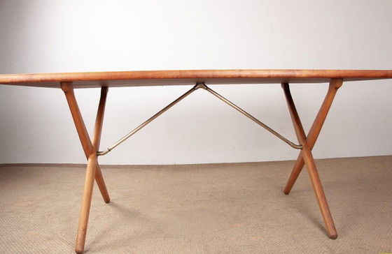 Image 1 of Deense eettafel van massief teak en beukenhout met messing, model AT 303, ontworpen door Hans Wegner voor Andreas Tuck in 1960.