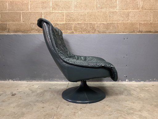 Fauteuil pivotant en cuir vert vintage seventies