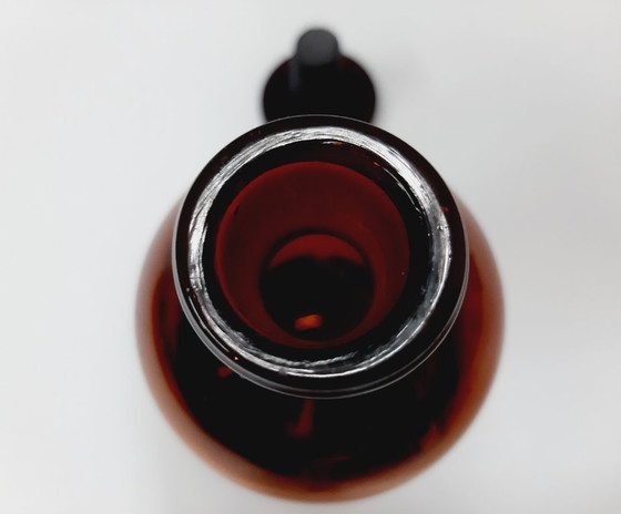 Image 1 of Vintage amberkleurige glazen apothekersfles met grondstop