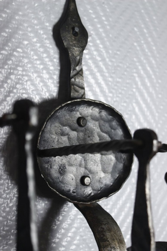 Image 1 of Pair of wrought iron castle-style wall sconces with candles, mid-20th century