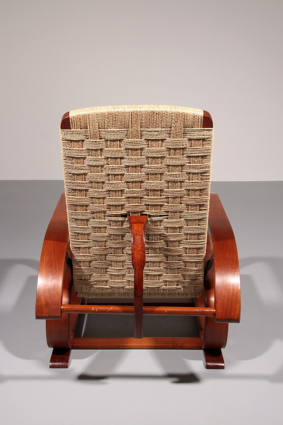 Image 1 of Een uitzonderlijk zeldzame mahoniehouten fauteuil gemaakt in Italië in de jaren 1950