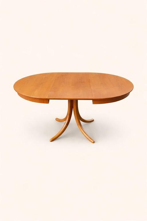 Round extendable dining table