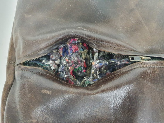 Image 1 of Dark brown leather ottoman. In good vintage condition