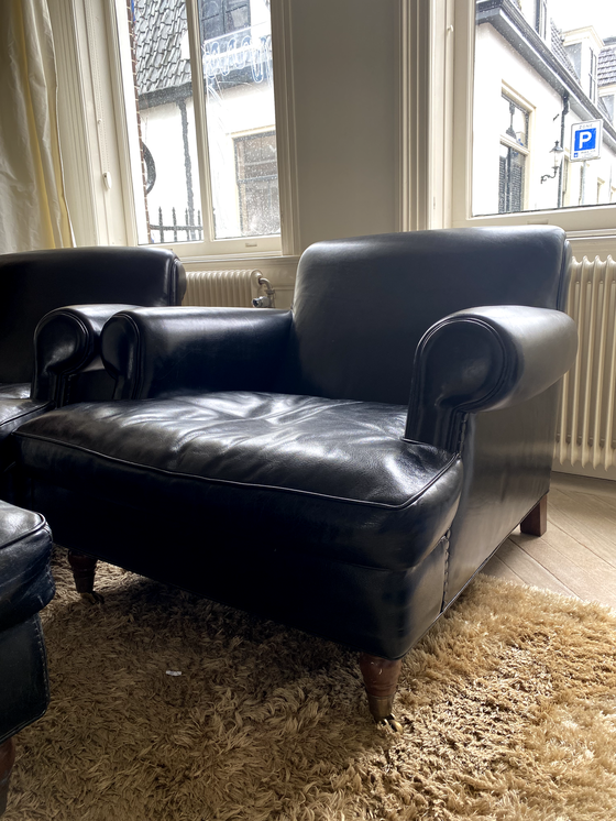 Image 1 of Baxter fauteuil + hocker, model Charlotte Longe (zwart leer)
