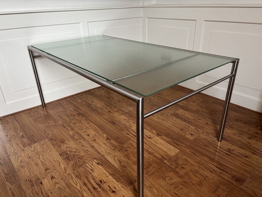 Modern dining table with glass table top