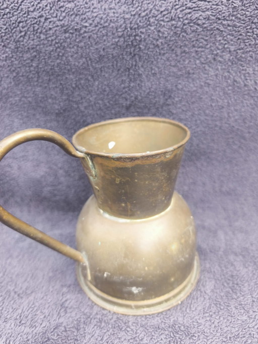 Juego de sartenes y tetera de cobre granate.